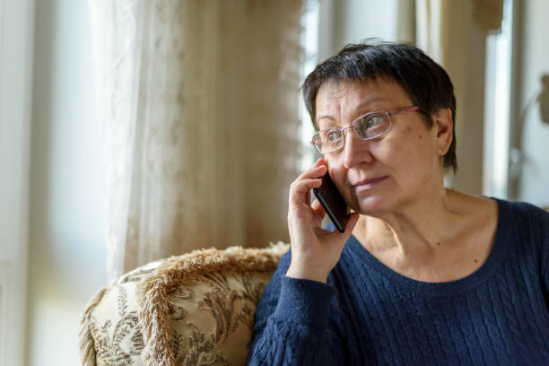 istock Senior woman talking on mobile phone 1393761562