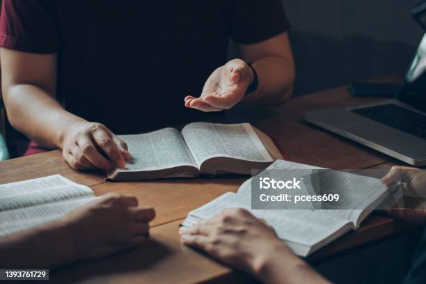 Christian Bible Study Concepts Christian Friends Groups Read And Study The Bible Together In A Home With Window Light Followers Are Studying The Word Of God In Churches Stock Photo - Download Image Now