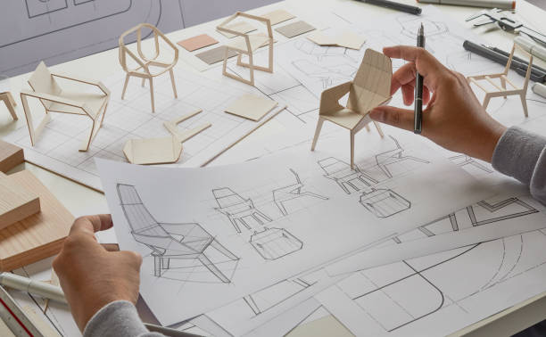 istock Designer sketching drawing design development product plan draft chair armchair Wingback Interior furniture prototype manufacturing production. designer studio concept . 1393762036
