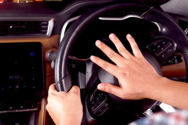 istock The driver is honking the horn to prevent an accident. 1393762964