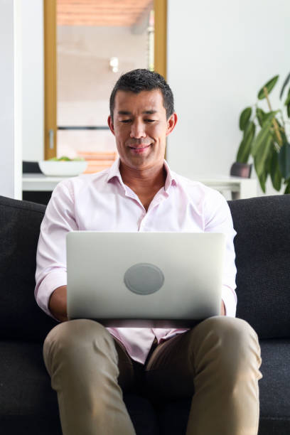 istock Man working at home on his laptop 1393763799