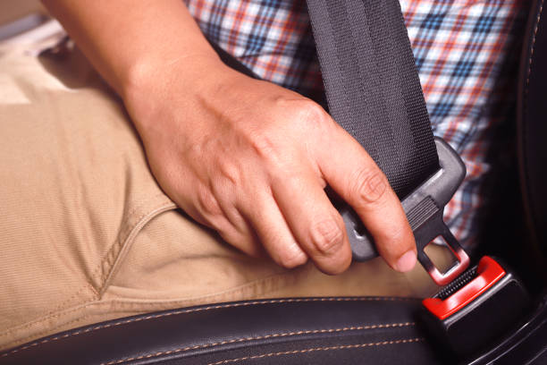 istock The driver wearing a seat belt Every time for safety road. 1393763847