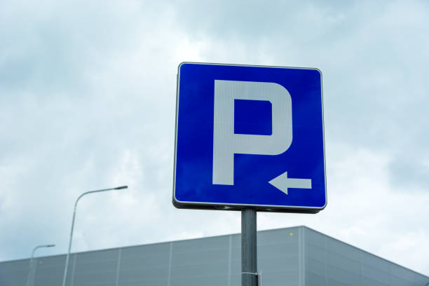 istock Blue road sign Parking with left arrow 1393765815