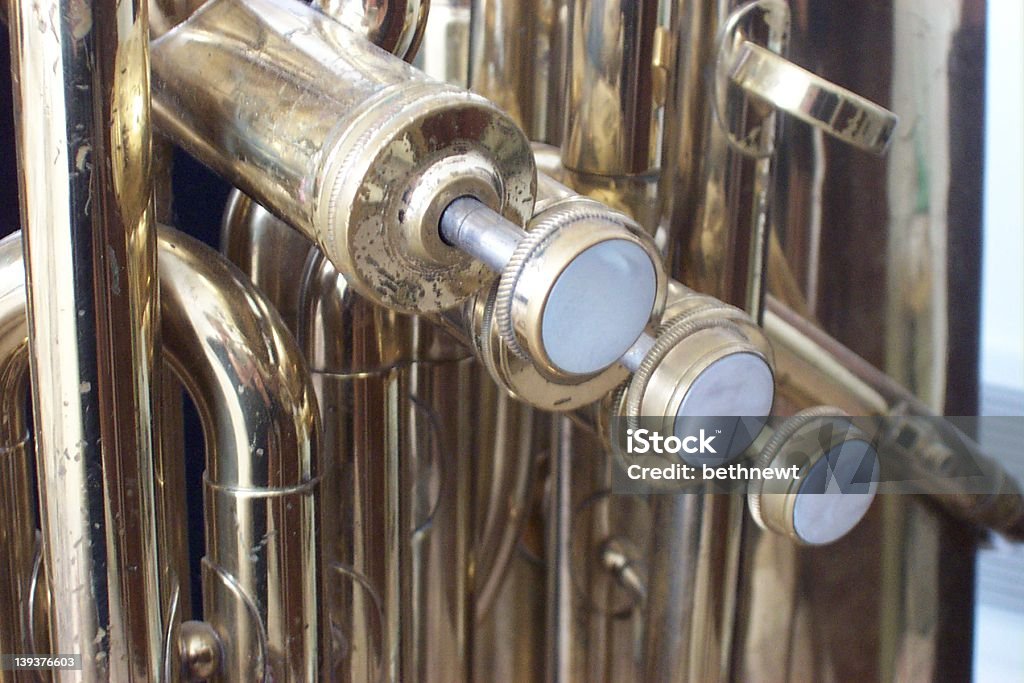 tuba valves close-up of a tuba showing the three valves (keys) Air Valve Stock Photo