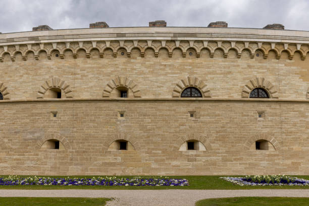 Norwich Castle keep on a spring day. The stone keep was constructed by order of the King between 1100 and 1120 to replace a wooden structure which stood on the same mound dating back to the Norman conquest of 1066. The castle was used as a prison until 1887 and has been used as a museum since 1894.