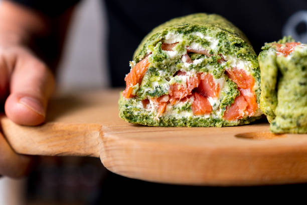 istock Roll spinach with salmon and cream cheese close up. Selective focus 1393769931