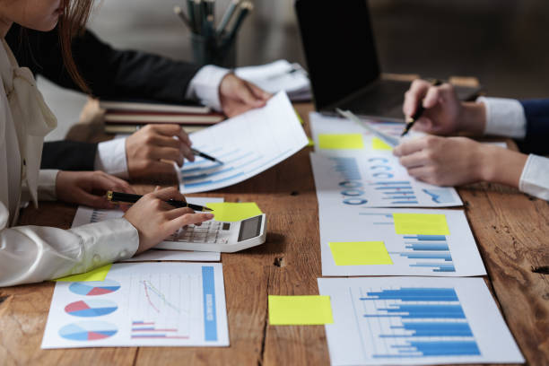 istock Group of Business people and Accountant checking data document on digital tablet for investigation of corruption account . Anti Bribery concept. 1393769936