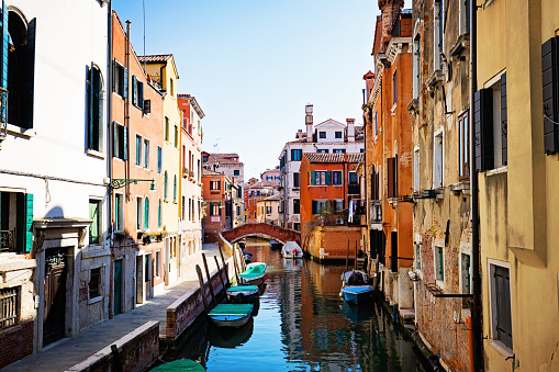 Venice, Italy - Jun 29, 2020: Rialto bridge and Grand Canal in Venice. Architecture and landmarks of Venice. Venice postcard with gondolas