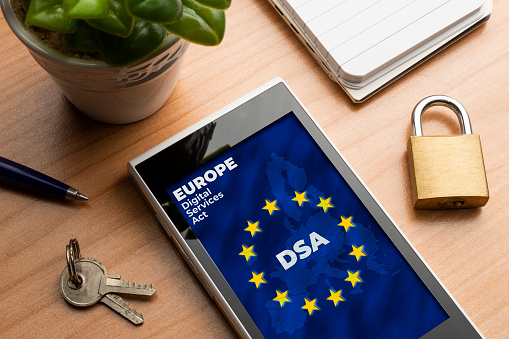 Digital Services Act (DSA) concept. Smartphone with the european map and flag with the text: DSA Digital Services Act