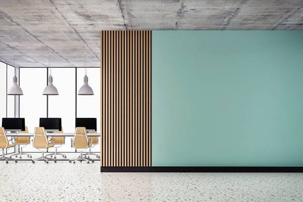 istock Empty office interior with copy space and work desks on terrazzo floor and paneled wall 1393772664