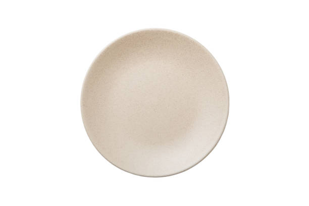 istock milky color ceramic round plate isolated over white background. Top view 1393775483