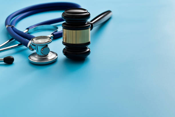 istock Gavel and stethoscope on blue background 1393776398