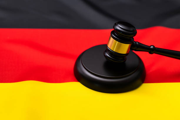 istock Wooden gavel on German flag 1393776564