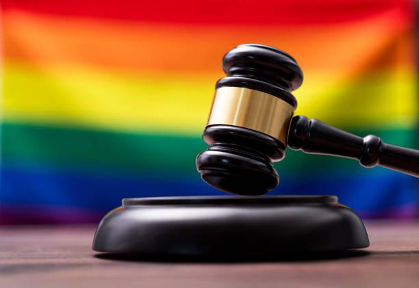 istock Wooden gavel and Rainbow flag 1393776597