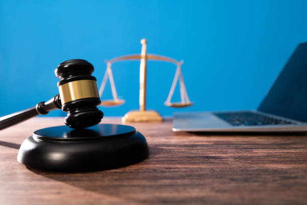 istock Gavel and laptop on the table 1393776701