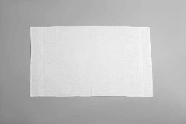istock White beach towel on light grey background, top view 1393777924