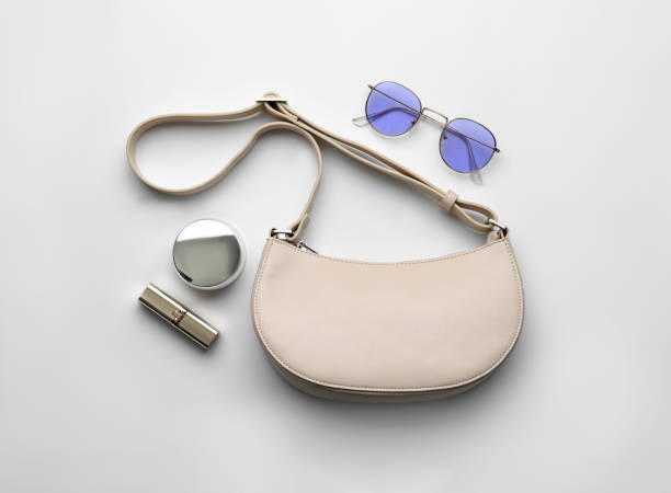 istock Flat lay composition with stylish woman's bag on light background 1393778564