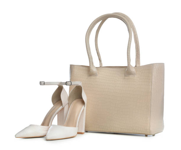 istock Stylish woman's bag and shoes isolated on white 1393778705