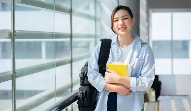 Photo of Image of young Asian college girl at school