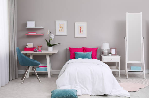 istock Modern teenager's room interior with comfortable bed and workplace 1393780173