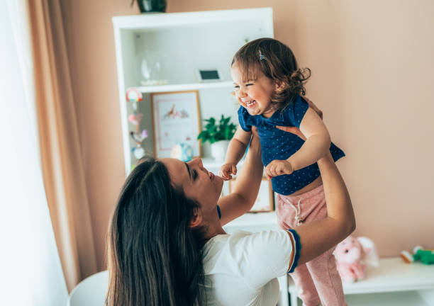 istock Mother and toddler having fun 1393782068