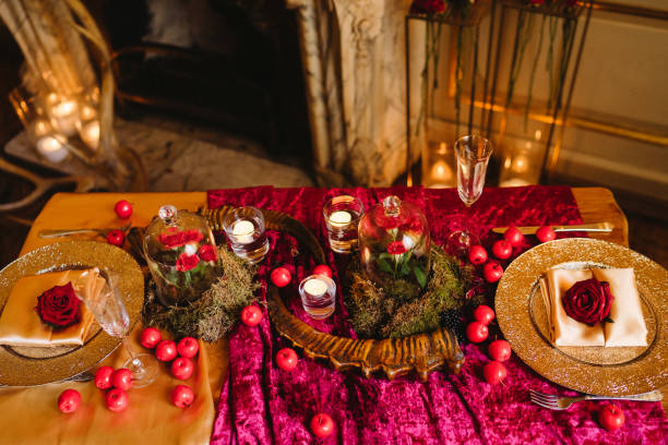 istock Floral compositions and candles on decorated dining table. 1393782243