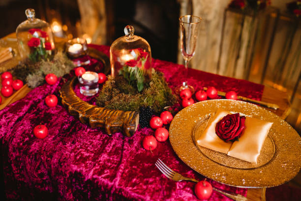 istock Floral compositions and candles on decorated dining table. 1393782278