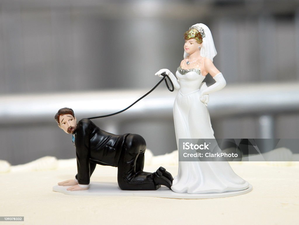 Cake Topper An amusing wedding cake topper. ~~If you use this image in something, I'd really like to see it.~~ Wedding Cake Figurine Stock Photo