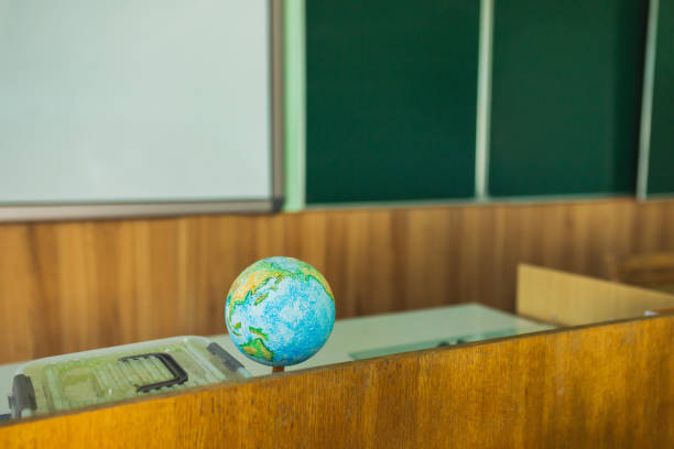 School board. Teacher's desk. Study geography. Natural Sciences. School desk in class. Classroom. University. Science. Globe