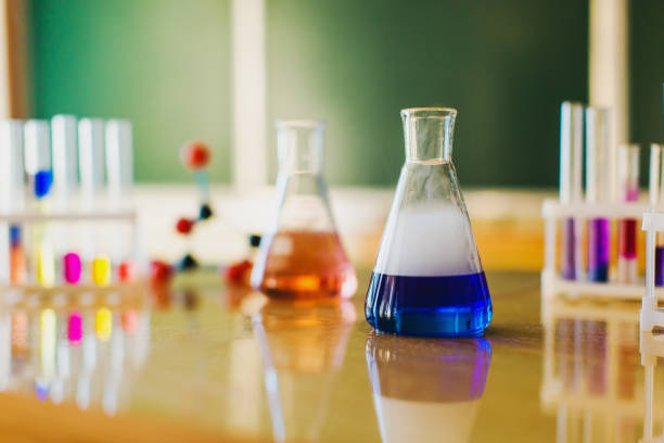 Color reagents in test tubes and flasks are on the table. Study chemistry. Natural Sciences. Desk. Classroom. Laboratory at the university. Biolaboratory. Science.