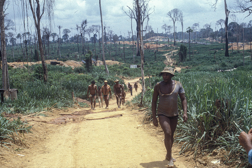 Garimpeiros in Serra Pelada Gold Mine, a village near Curionópolis, Amazon, Pará State, Brazil. Serra Pelada was a large gold mine in Brazil in the 1980’s. Gold Rush, 1986.