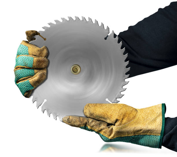 istock Gloved Hands Holding a Metal Circular Saw Blade Isolated on White Background 1393785644