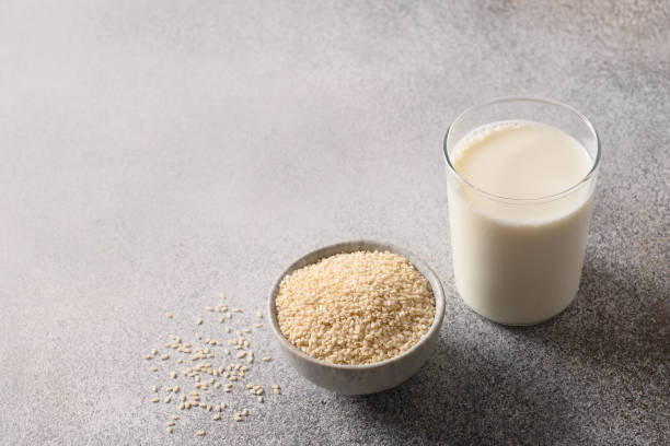 istock Vegan plant based sesame milk on gray background. 1393786605