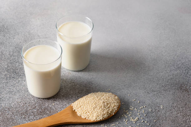 istock Vegan plant based sesame milk on gray background. 1393786618