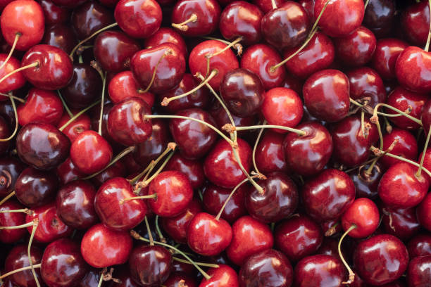 istock Background image of lying red ripe sweet cherries. Top view, flat lay. Copy space 1393788170
