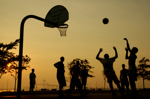 pick-up basketball game at an outdoor park at sunset in newport, RI