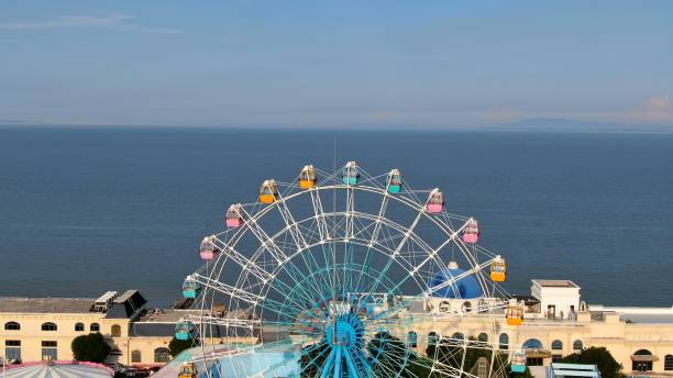 istock Amusement park on the coast, Ferris wheel 1393788365