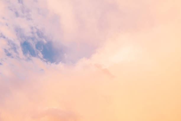 istock Background image of blue bright sky with pastel pink and white clouds. Beautiful sky pattern on clear day 1393788390