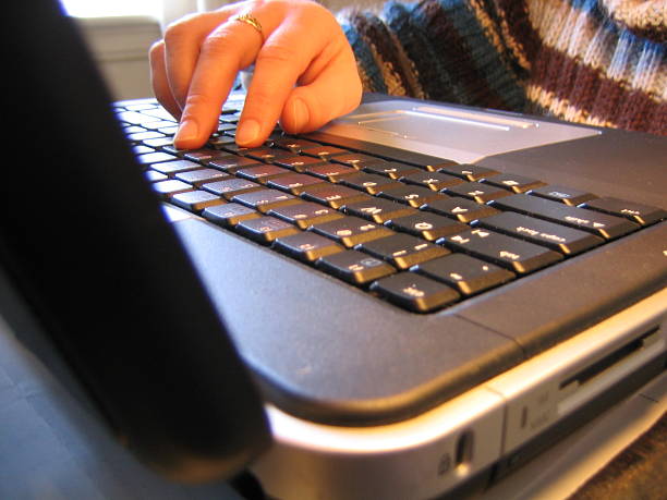 Woman working on a laptop stock photo