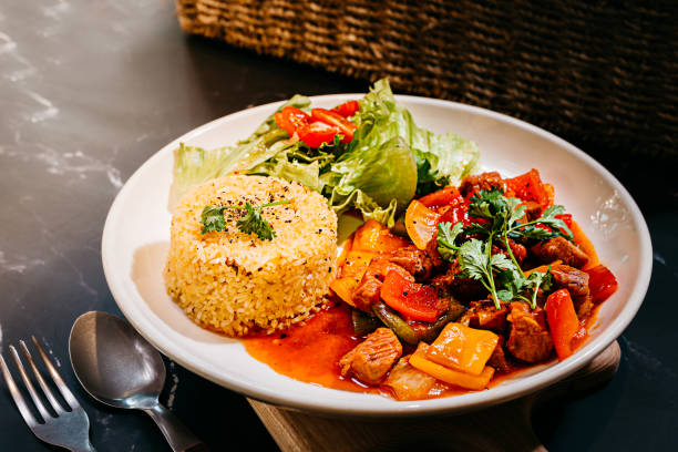Chinese Traditional Fried Rice with shaky beef, vegetables served on a white plate high resolution stock photo