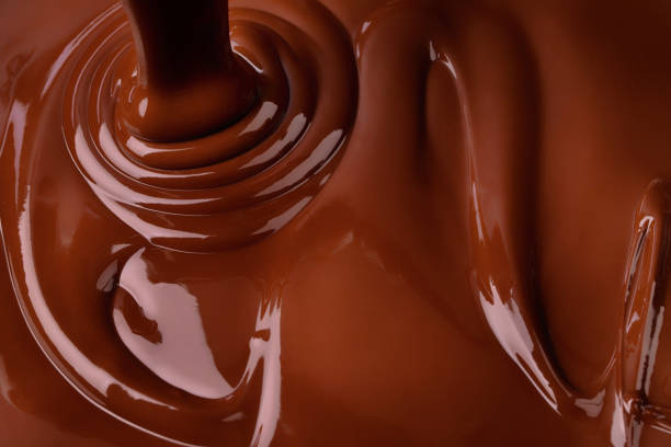 istock melted dark chocolate background. pouring liquid cocoa dessert 1393791636