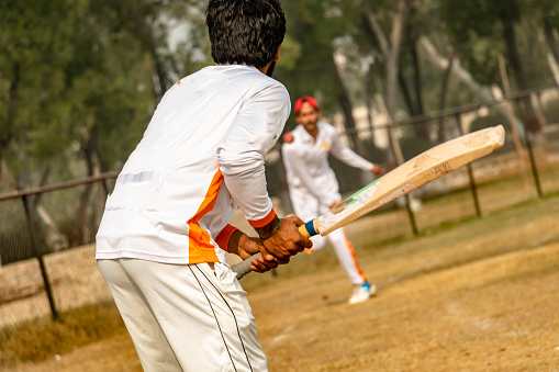 cricket team practicing on match ground