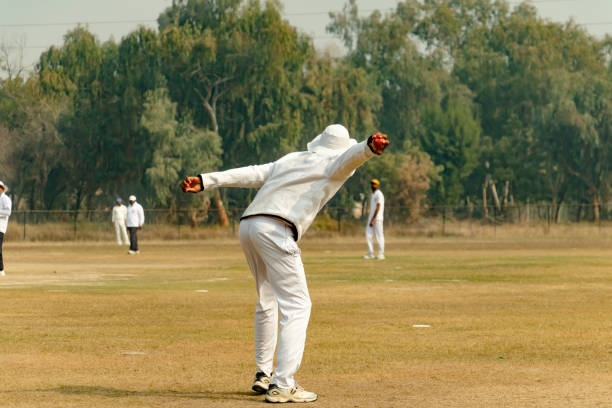 istock fielder throwing ball to the keeper 1393791879