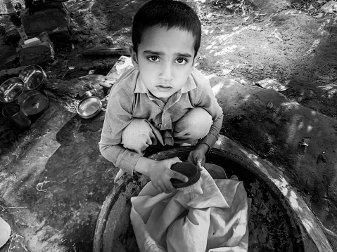 Poor Indian children asking for support. Many Indian children suffer from poverty - more than 50% of India's total population lives below the poverty line, and more than 40% of this population are children.