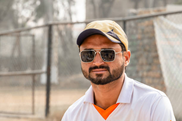 istock young cricket player in match ground 1393792577