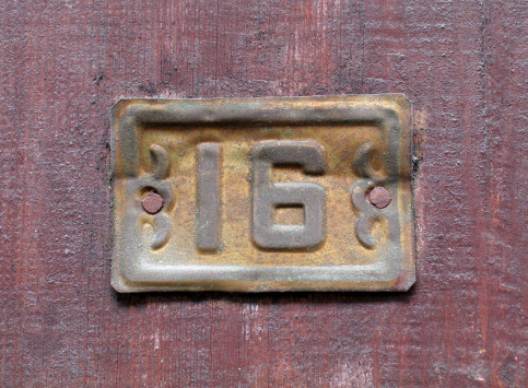 Number sixteen on a door