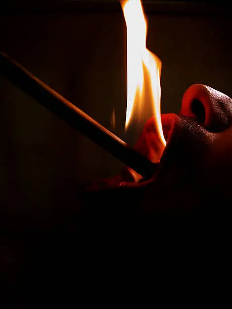 Flame curling around my lip whilst fire eating !