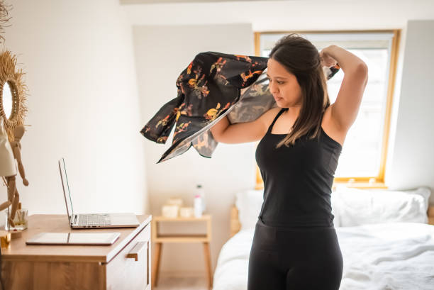 istock Young Woman getting ready to work using mobile devices in the morning 1393795157