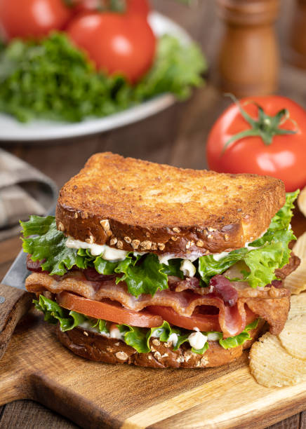 istock Bacon, lettuce and tomato sandwich on a cutting board 1393795188