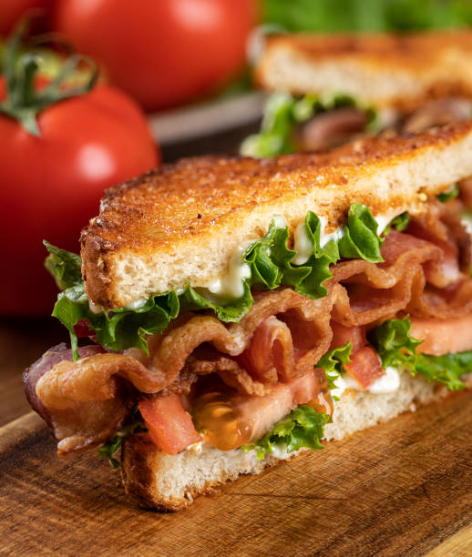 istock Bacon, lettuce and tomato sandwich cut in half 1393795194